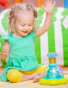 Bright Starts Press & Glow Spinner jucărie cu activități cu melodie 6 m+ 1 buc