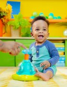 Bright Starts Press & Glow Spinner jucărie cu activități cu melodie 6 m+ 1 buc
