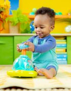 Bright Starts Press & Glow Spinner jucărie cu activități cu melodie 6 m+ 1 buc