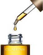 Clarins Lotus Treatment Oil ulei de regenerare cu efect de netezire ziua și noaptea 30 ml