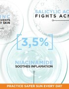 Garnier Ambre Solaire Super UV Niacinamide fluid protecție impotriva imperfectiunilor pielii SPF 50+ 40 ml