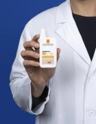 La Roche-Posay Anthelios UVMUNE 400 fluid protector tonifiant pentru față SPF 50+ 50 ml