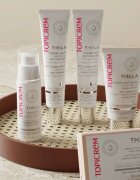 Topicrem MELA Unifying Exfoliating Bar sapun pentru curatare cu efect de exfoliere pentru față și corp 150 g