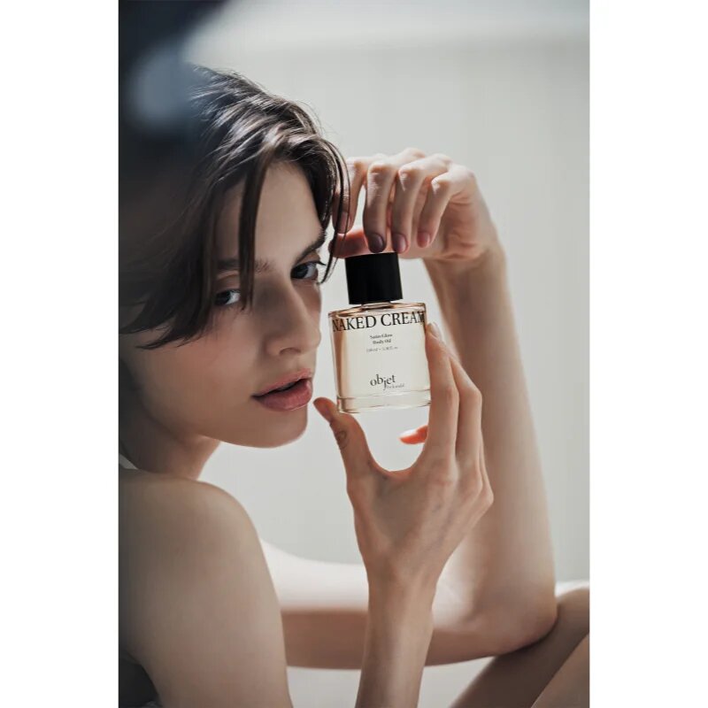 KUNDAL Objet Satin Glow Body Oil ulei de corp hranitor pentru hidratare intensa cu parfum Naked Cream 100 ml